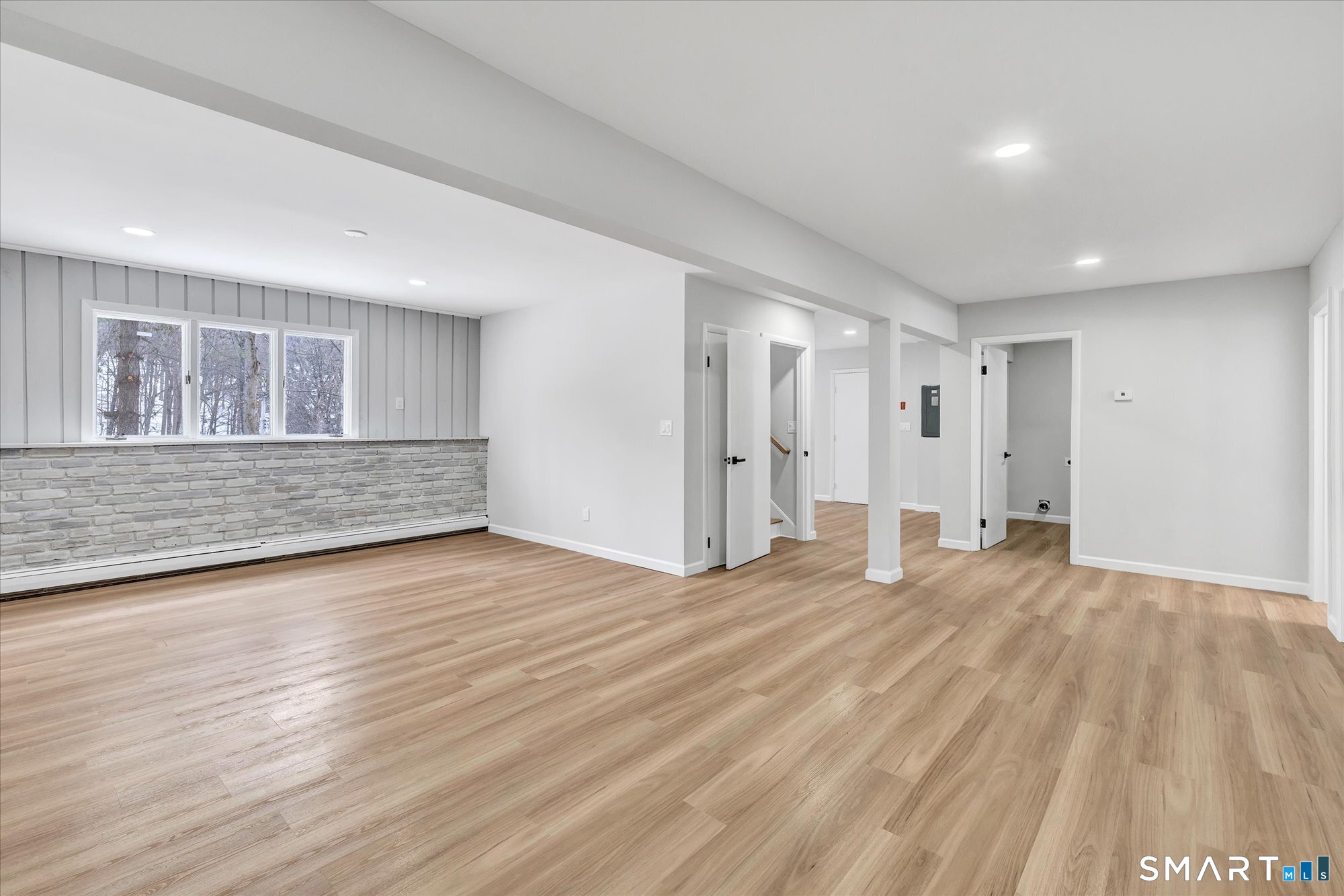 176 Strobel Road Trumbull, CT 06611 - Photo 32 of 39 a view of an empty room with wooden floor and a window
