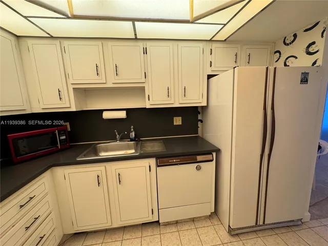 a view of a refrigerator and window