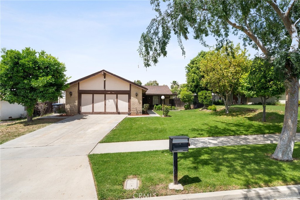 1045 Bascomb Drive Riverside, CA 92507 - Photo 1 of 1 a front view of a house with a yard