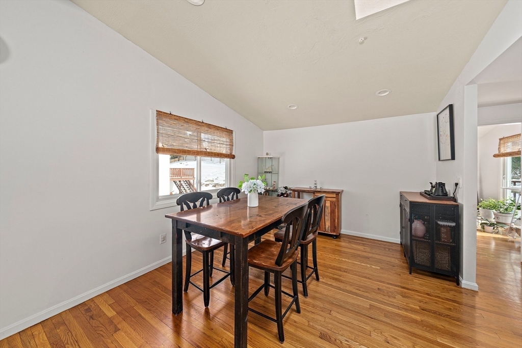 50 Badger Road Framingham, MA 01702 - Photo 8 of 41 a view of a dining room with furniture and wooden floor