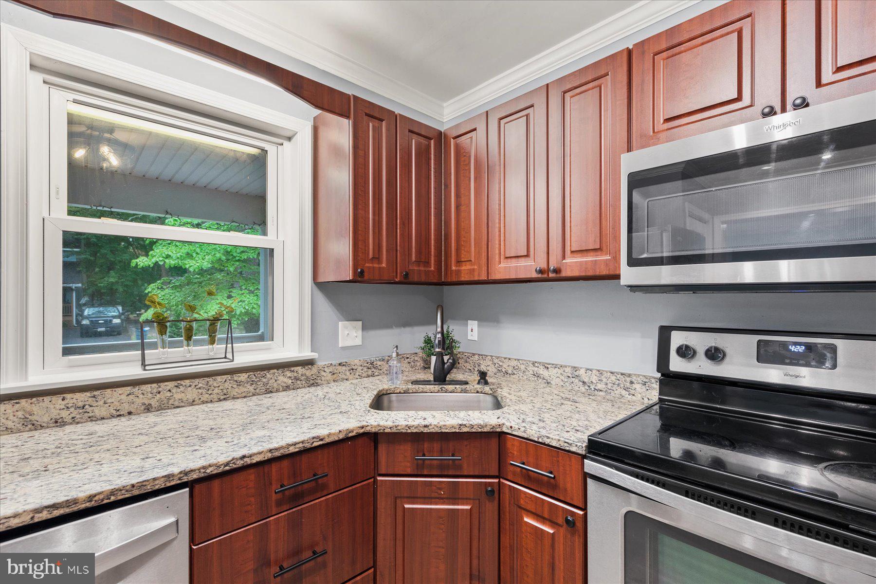 4 Poacher Berlin, MD 21811 - Photo 11 of 45 a kitchen with stainless steel appliances granite countertop a sink stove and microwave