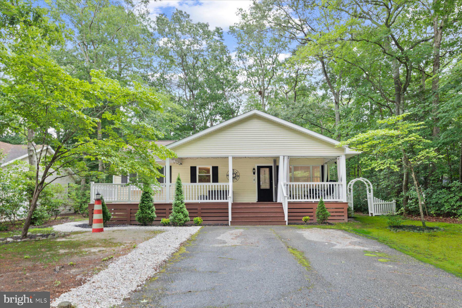 4 Poacher Berlin, MD 21811 - Photo 2 of 45 a view of a house with a yard and large tree