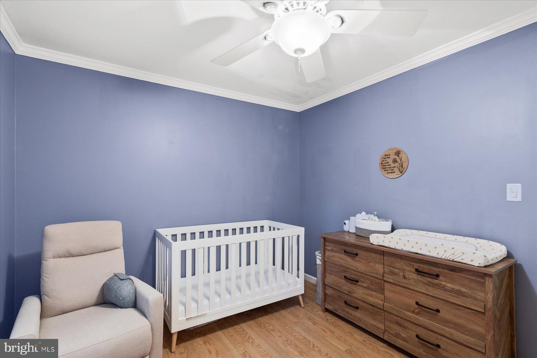 4 Poacher Berlin, MD 21811 - Photo 26 of 45 a bedroom with a bed and a chandelier