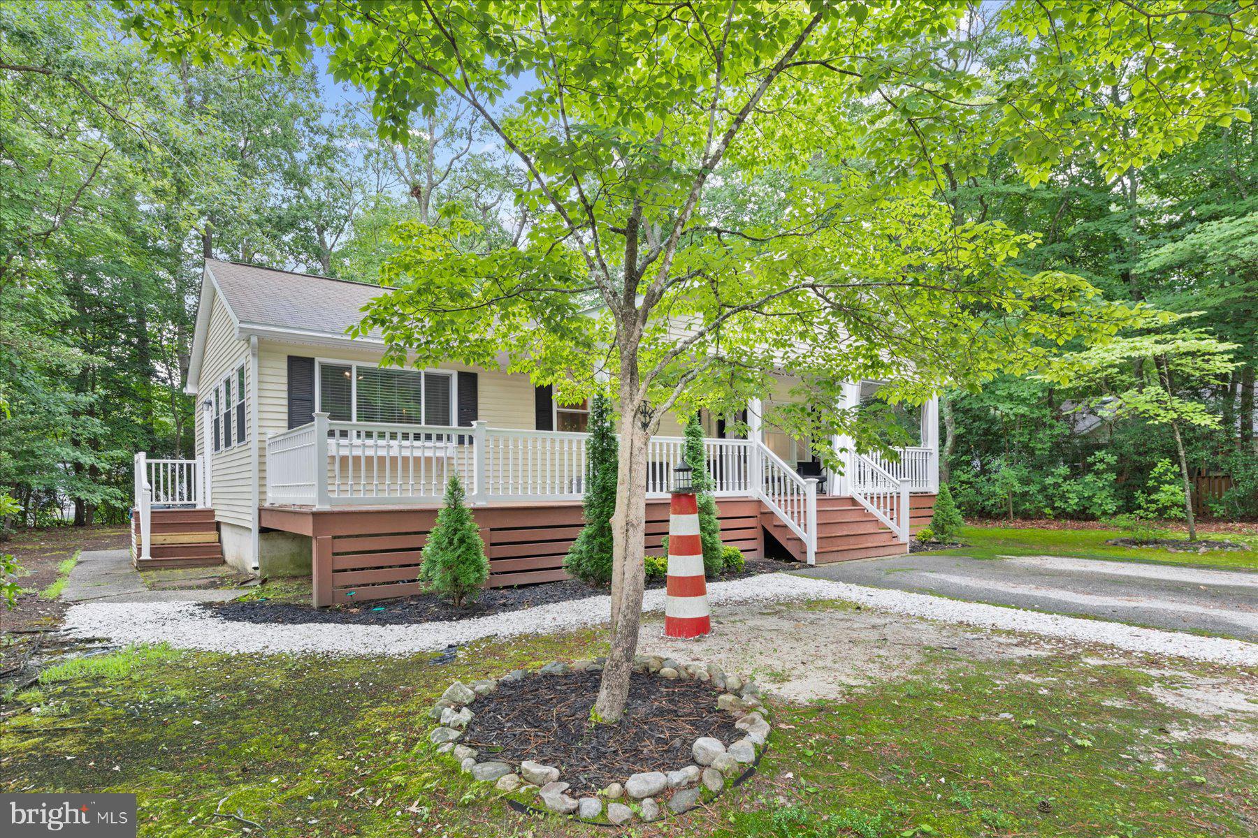 4 Poacher Berlin, MD 21811 - Photo 3 of 45 a view of a house with a backyard and a tree