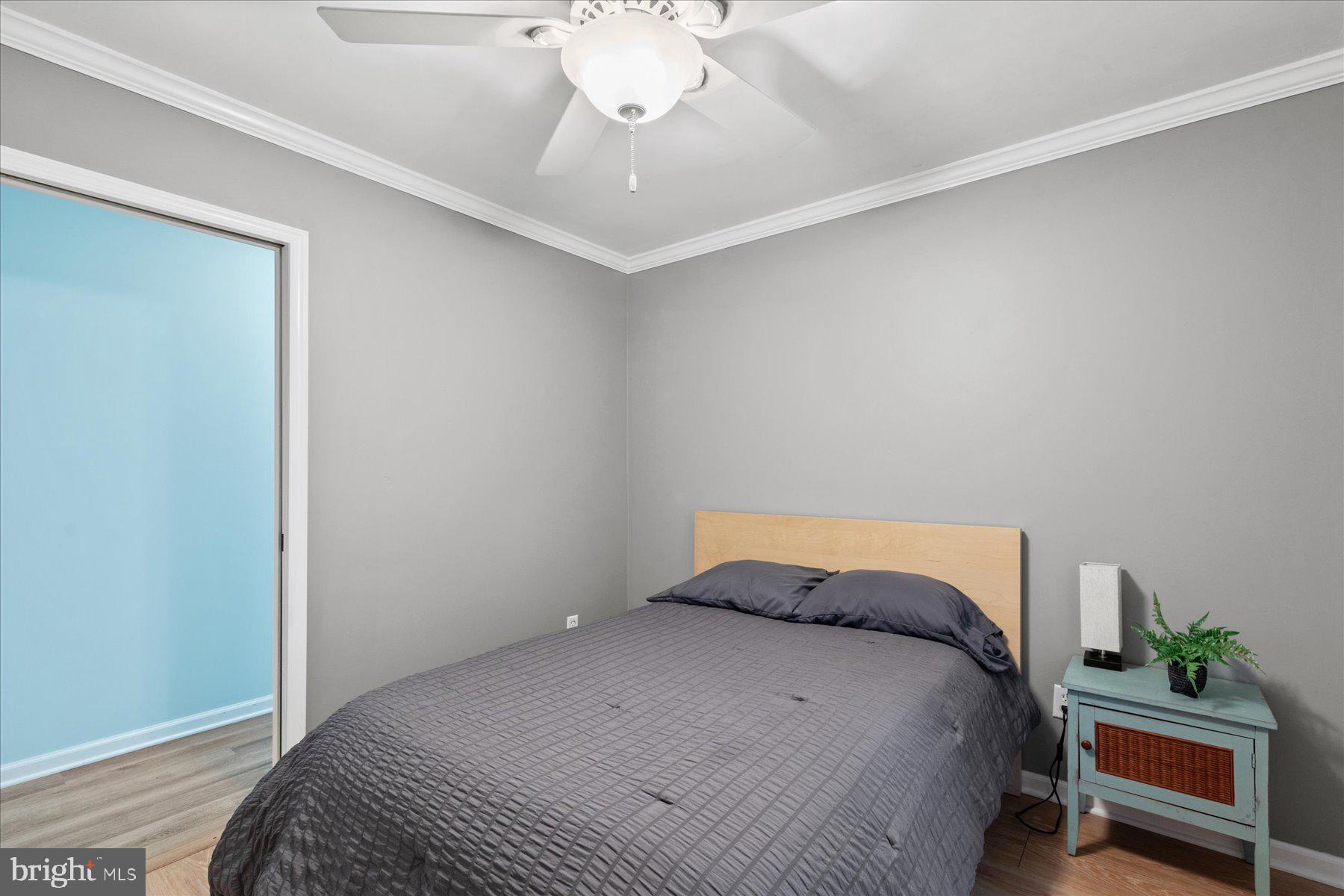 4 Poacher Berlin, MD 21811 - Photo 32 of 45 a bedroom with a bed and a chandelier