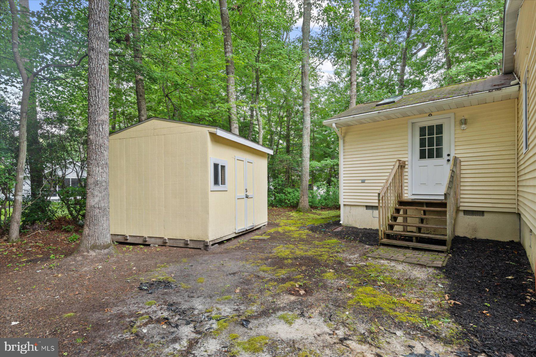 4 Poacher Berlin, MD 21811 - Photo 40 of 45 a view of a small house with backyard