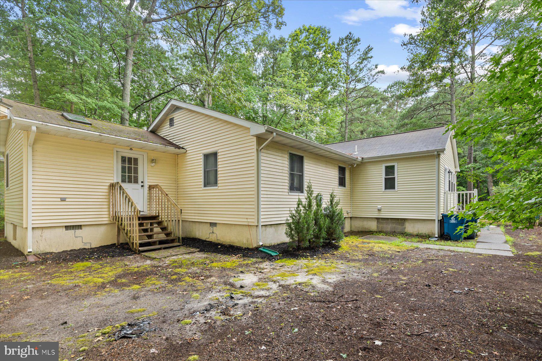 4 Poacher Berlin, MD 21811 - Photo 41 of 45 a view of a house with backyard and chairs