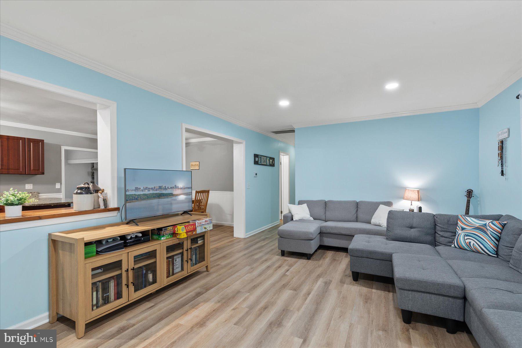 4 Poacher Berlin, MD 21811 - Photo 8 of 45 a living room with furniture and a flat screen tv