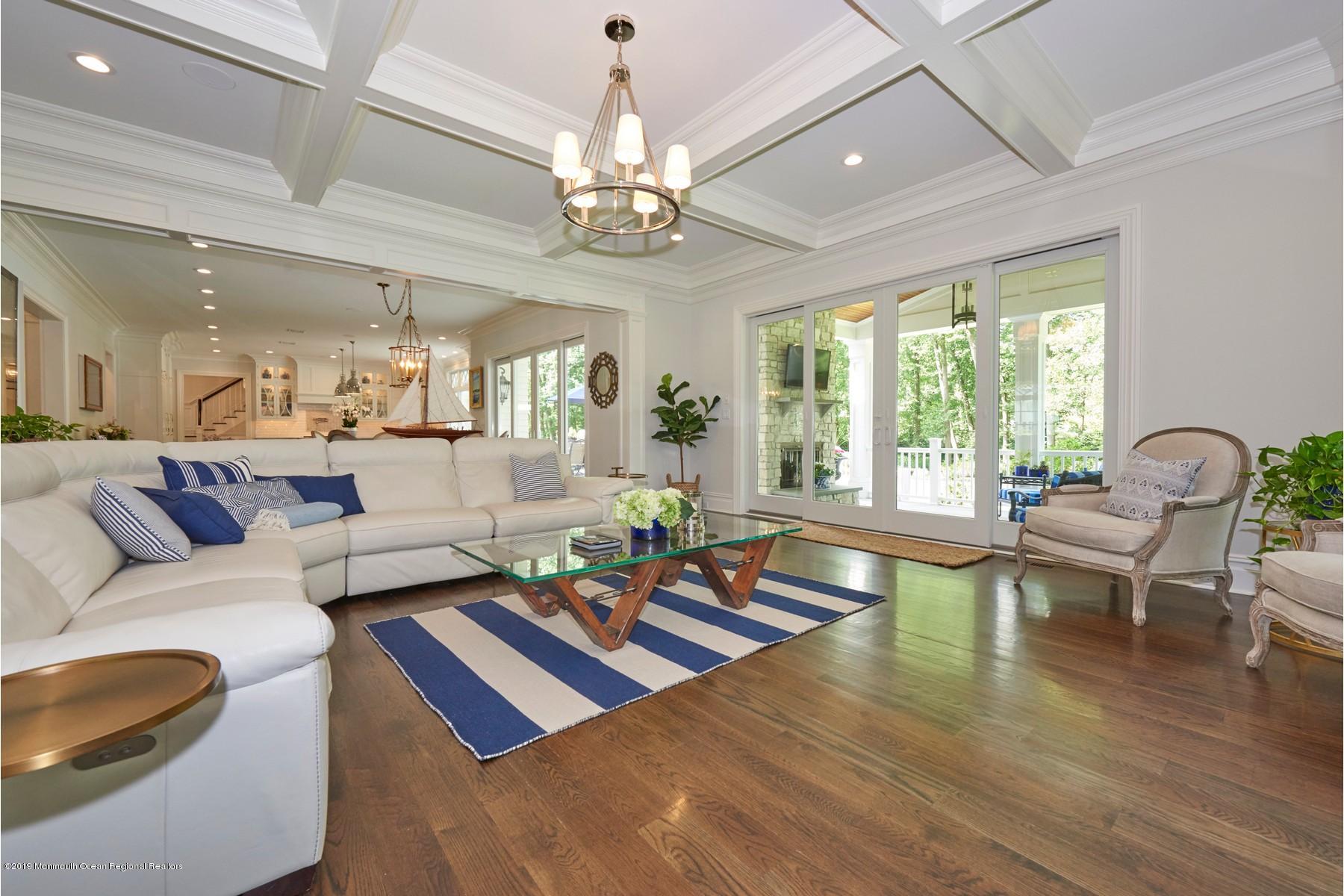 8 Heathcliff Road Rumson, NJ 07760 - Photo 13 of 46 a living room with furniture or chandelier and a wooden floor
