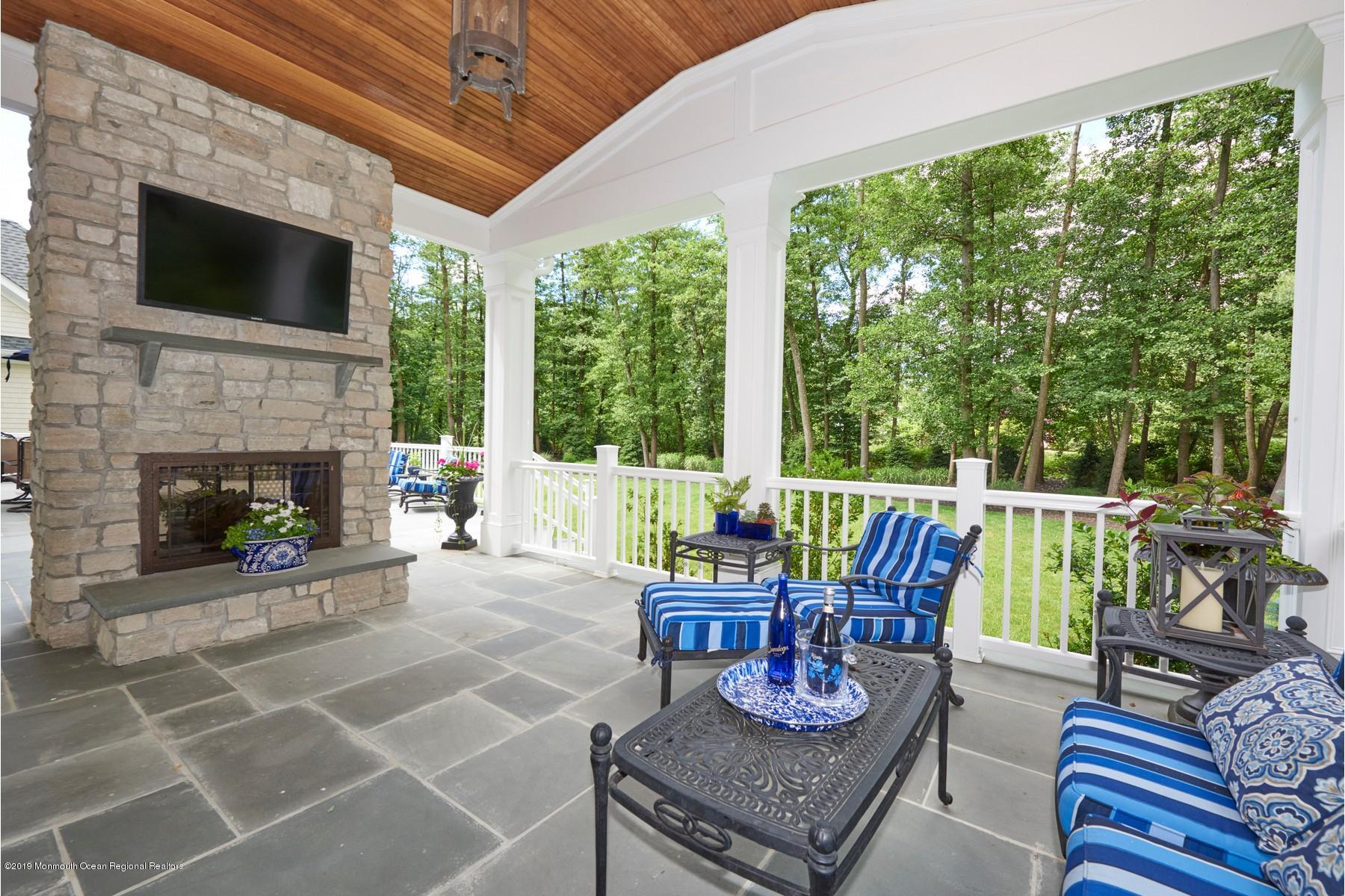 8 Heathcliff Road Rumson, NJ 07760 - Photo 14 of 46 a living room with furniture and a fireplace