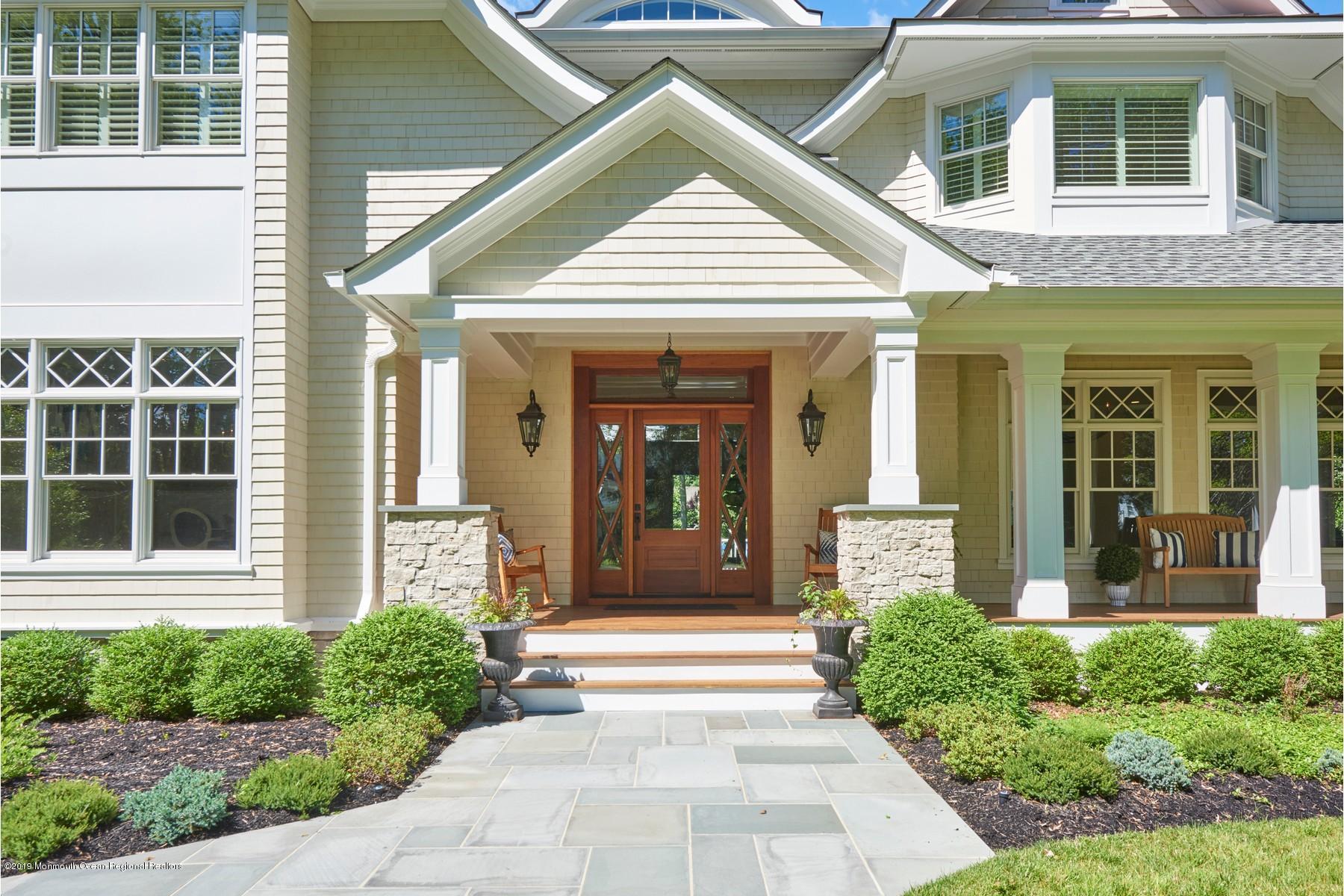 8 Heathcliff Road Rumson, NJ 07760 - Photo 2 of 46 a front view of a house with a porch