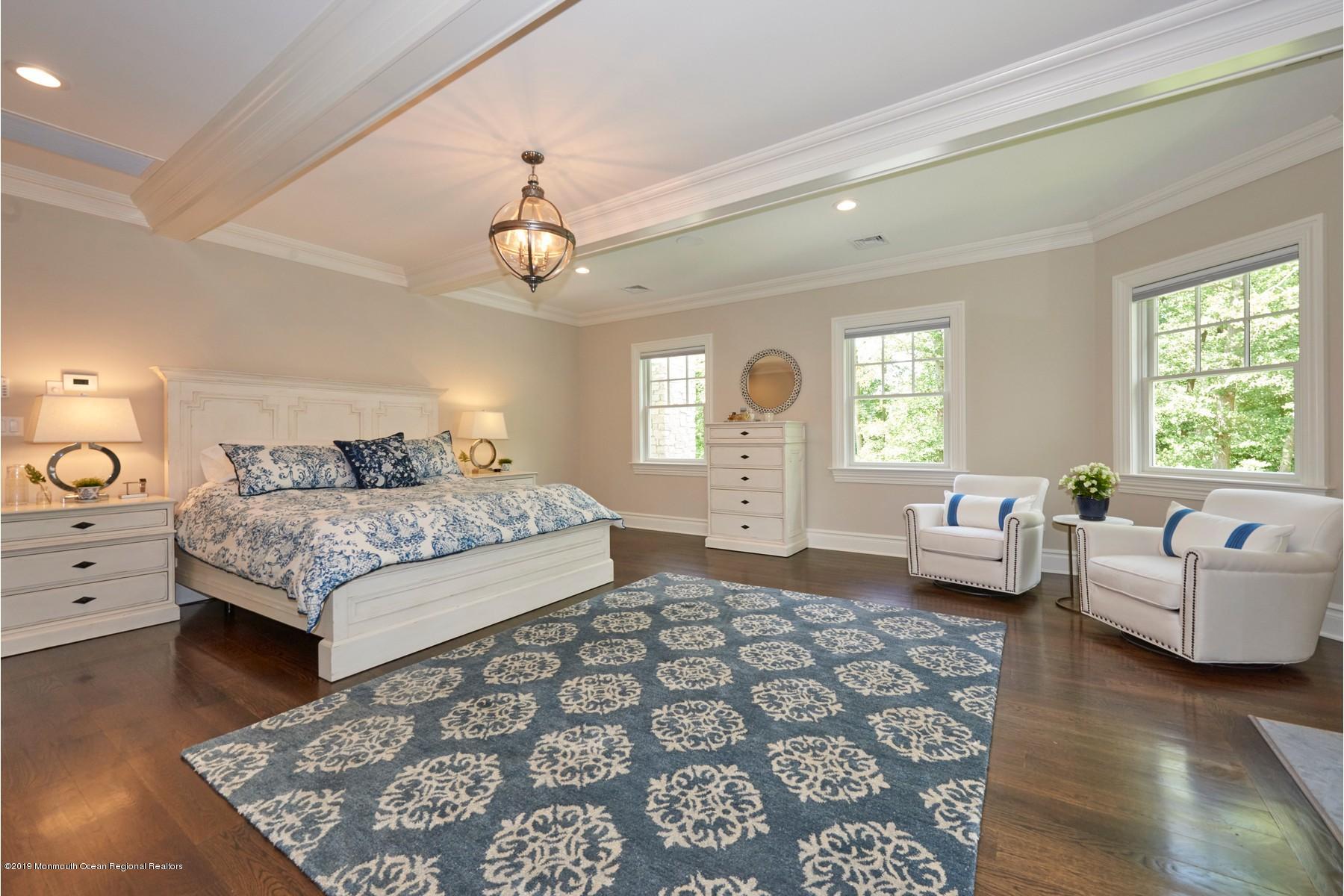 8 Heathcliff Road Rumson, NJ 07760 - Photo 22 of 46 a bedroom with a bed and furniture with wooden floor
