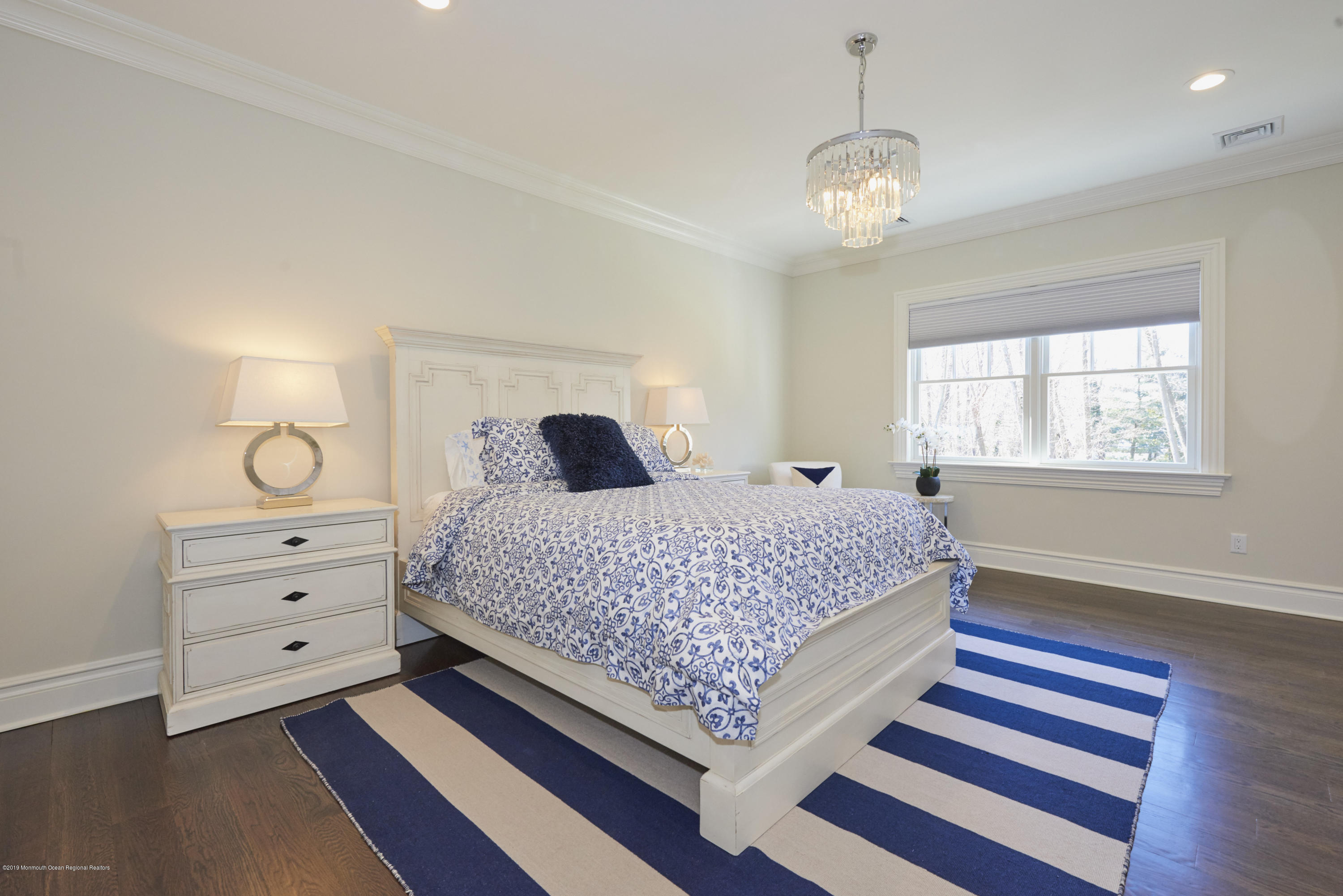8 Heathcliff Road Rumson, NJ 07760 - Photo 28 of 46 a bedroom with a bed and a window