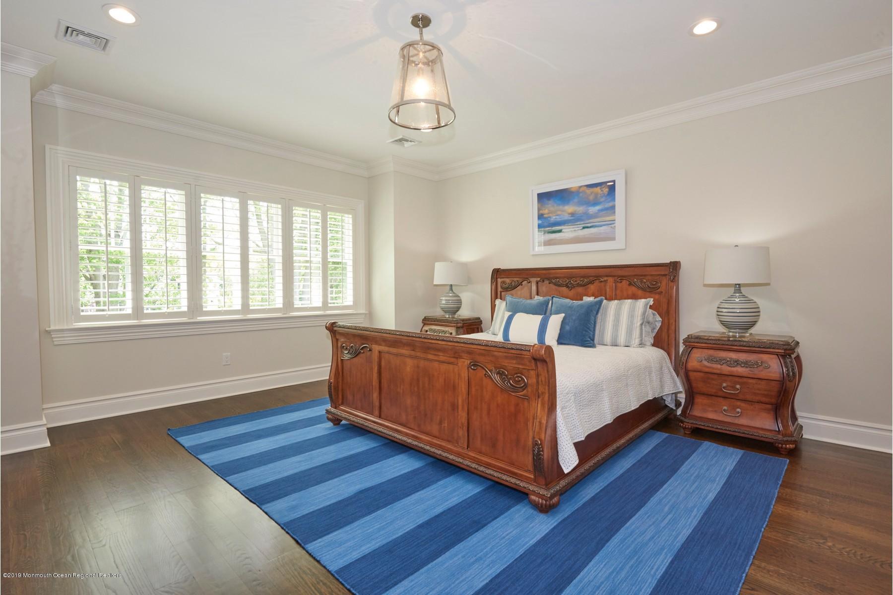 8 Heathcliff Road Rumson, NJ 07760 - Photo 29 of 46 a bedroom with a bed and window