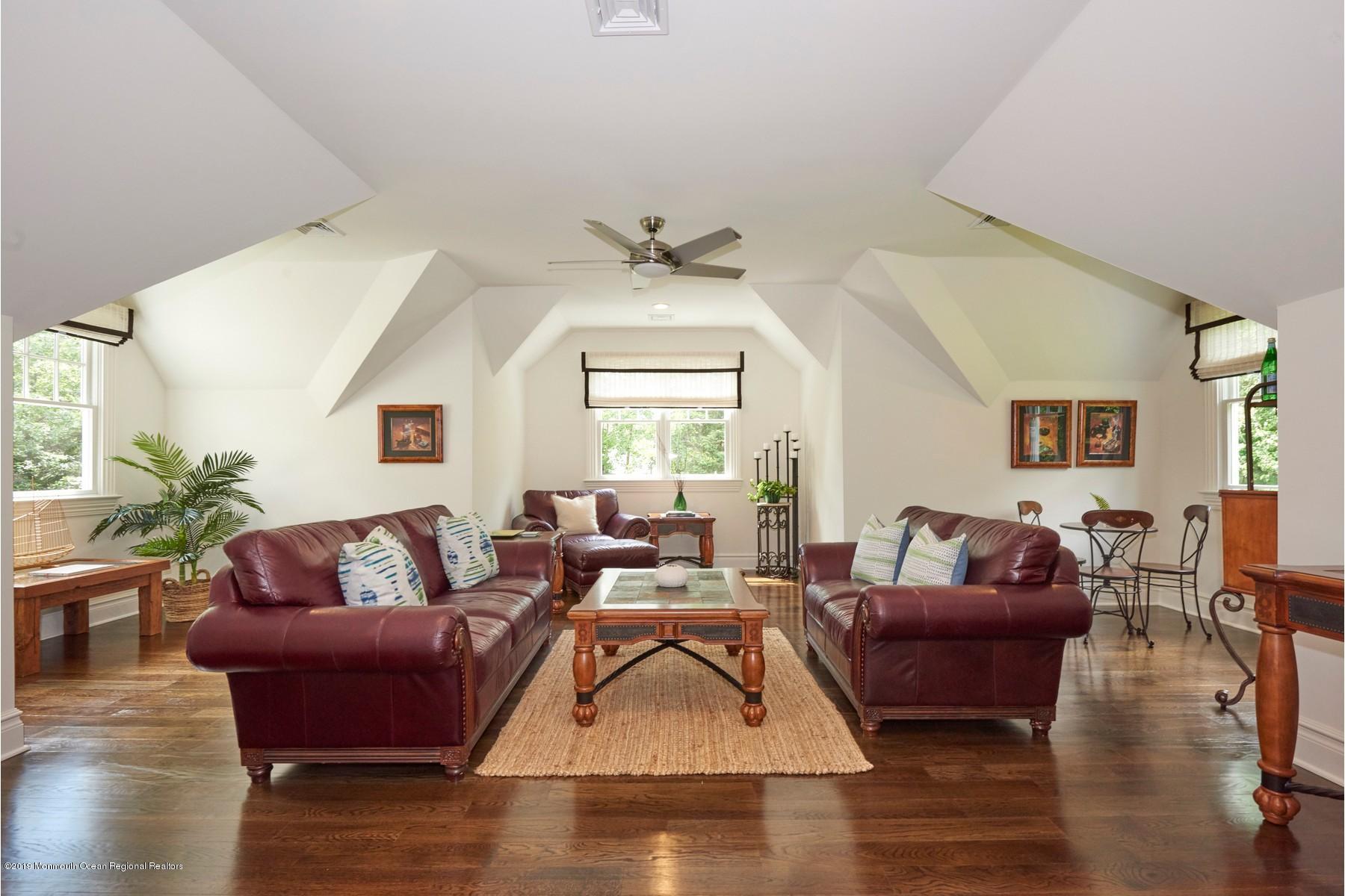 8 Heathcliff Road Rumson, NJ 07760 - Photo 33 of 46 a living room with furniture and a large window