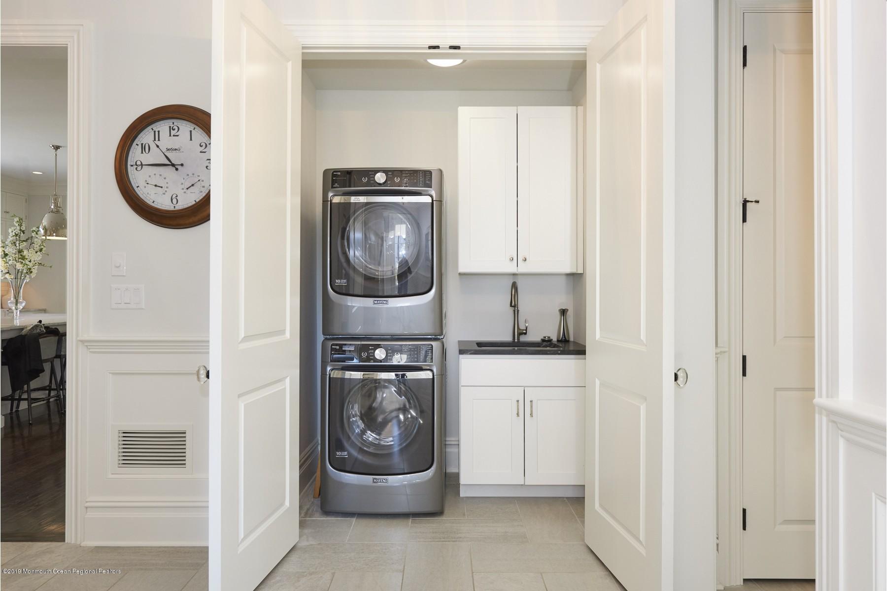 8 Heathcliff Road Rumson, NJ 07760 - Photo 37 of 46 a view of a hallway with washer and dryer