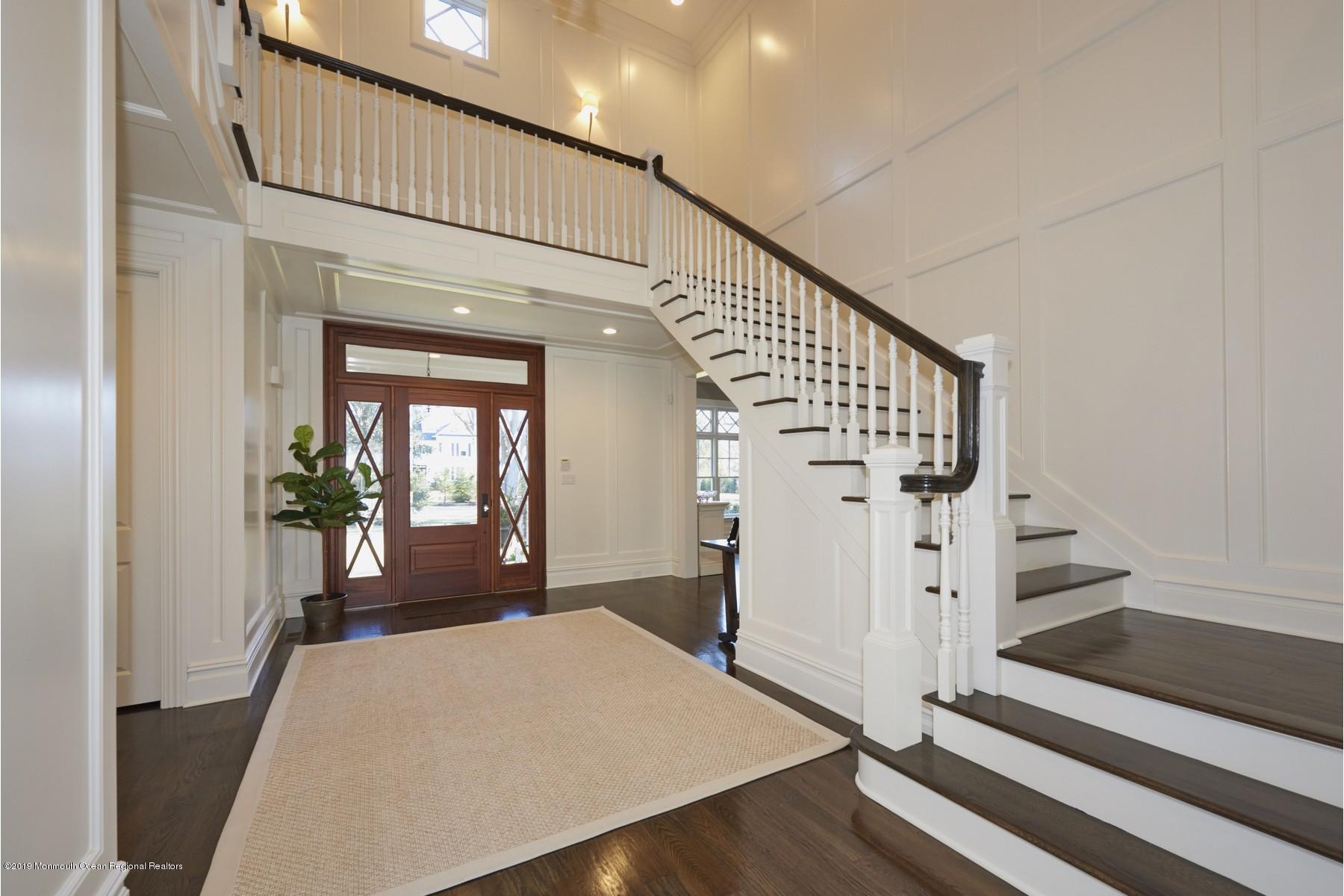 8 Heathcliff Road Rumson, NJ 07760 - Photo 4 of 46 a view of a livingroom with wooden floor and stairs