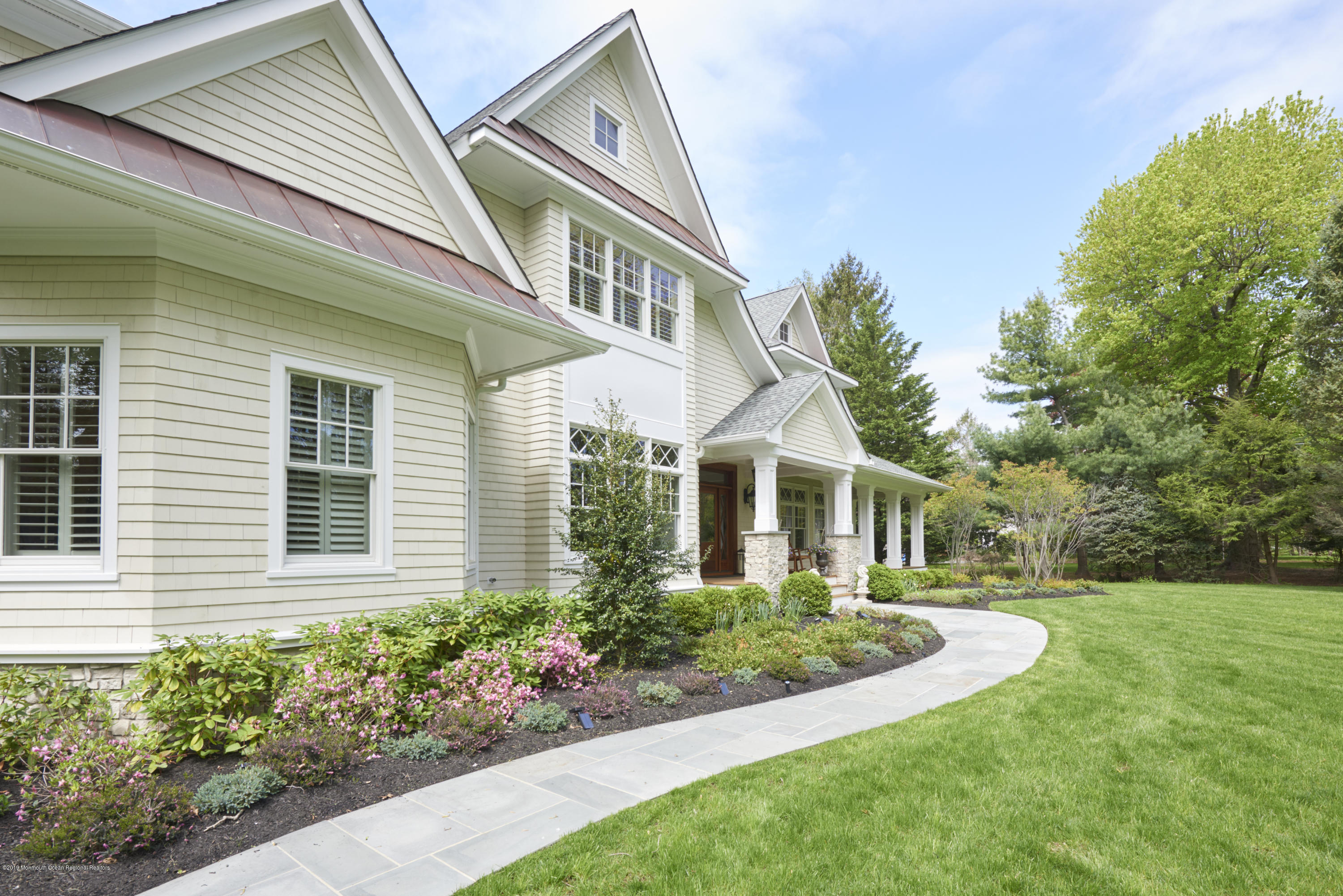 8 Heathcliff Road Rumson, NJ 07760 - Photo 44 of 46 a front view of a house with a garden
