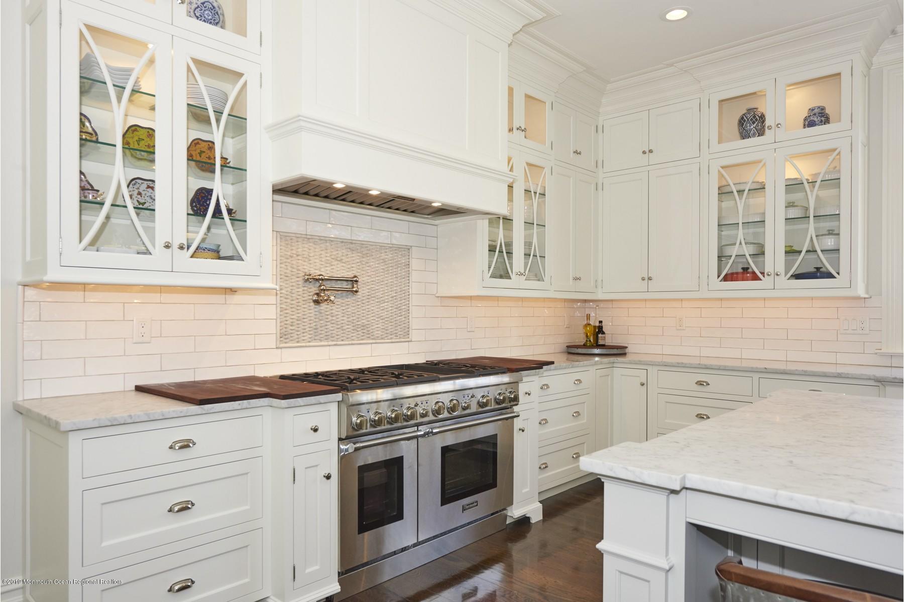 8 Heathcliff Road Rumson, NJ 07760 - Photo 6 of 46 a kitchen with granite countertop cabinets stainless steel appliances and a stove