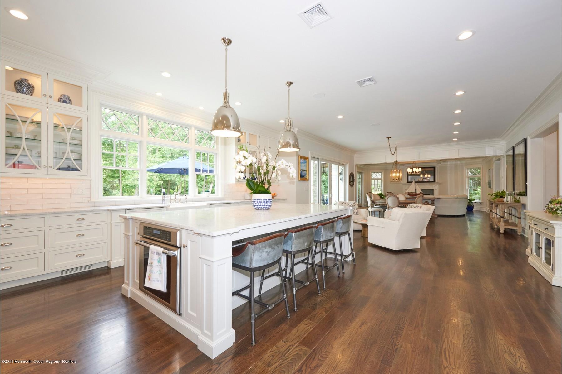 8 Heathcliff Road Rumson, NJ 07760 - Photo 7 of 46 a open kitchen with stainless steel appliances granite countertop a white cabinets and wooden floor