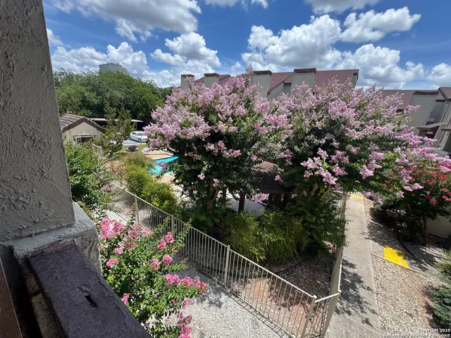 a view of a room with wooden floor and staircase