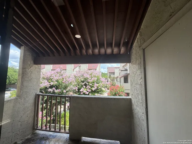 a view of outdoor space with wooden floor