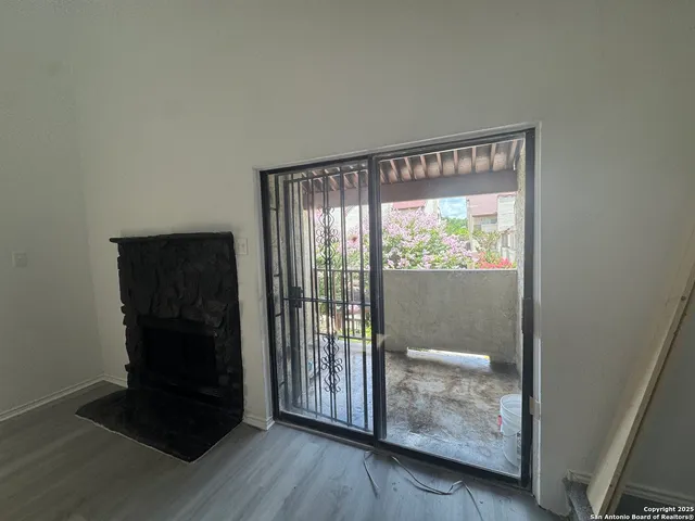 a bathroom with a toilet a sink a mirror and a shower