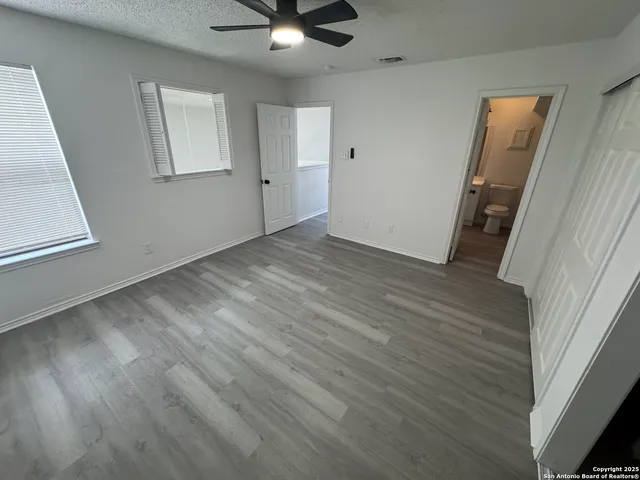 a bathroom with a tub sink toilet and a shower