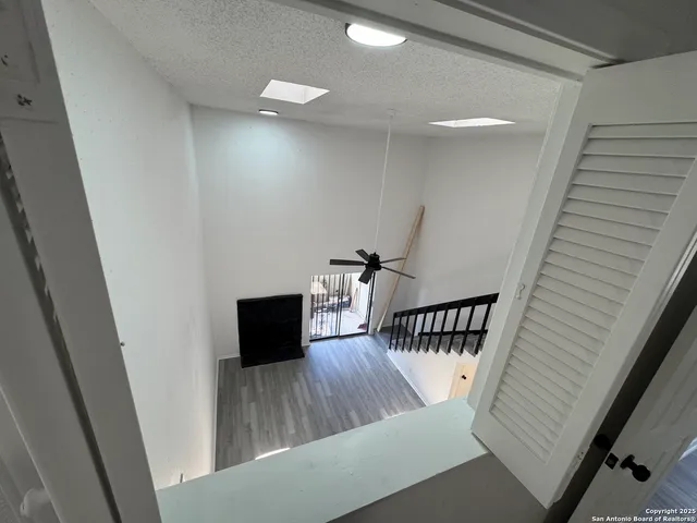 a view of a couches chair and wooden floor in a room