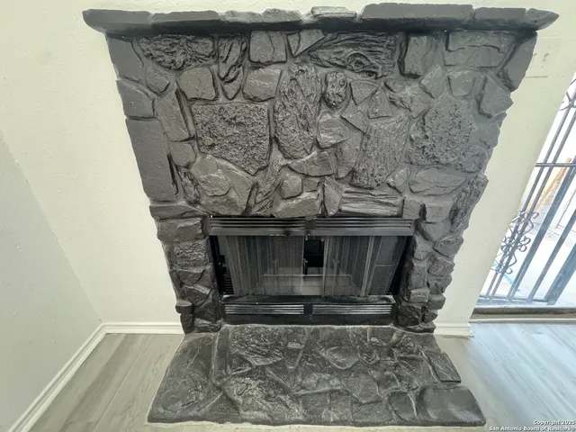 a kitchen with wooden cabinets and white appliances