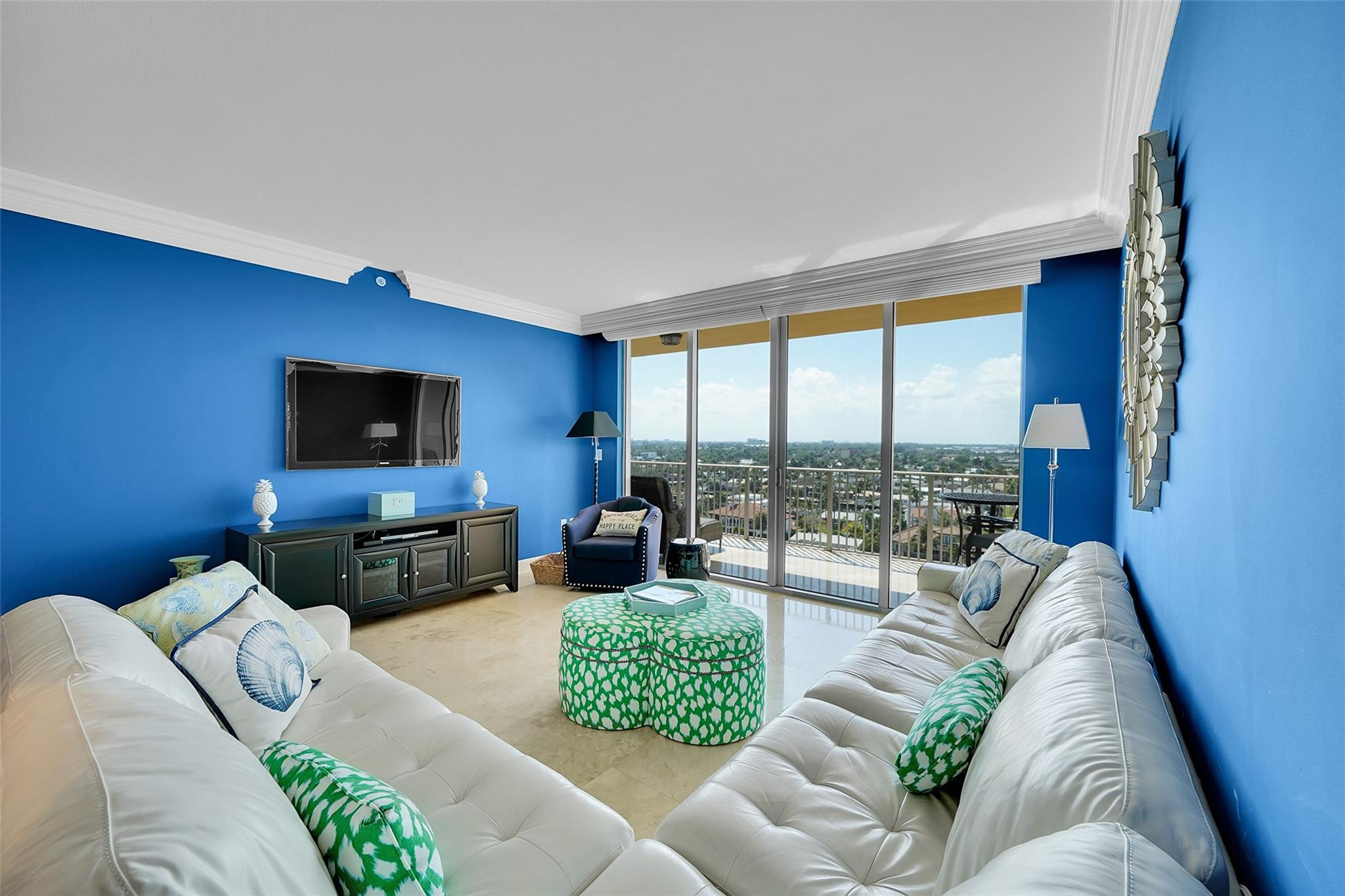821 North Riverside Drive, Unit PH2 Pompano Beach, FL 33062 - Photo 28 of 95 a living room with furniture and a flat screen tv