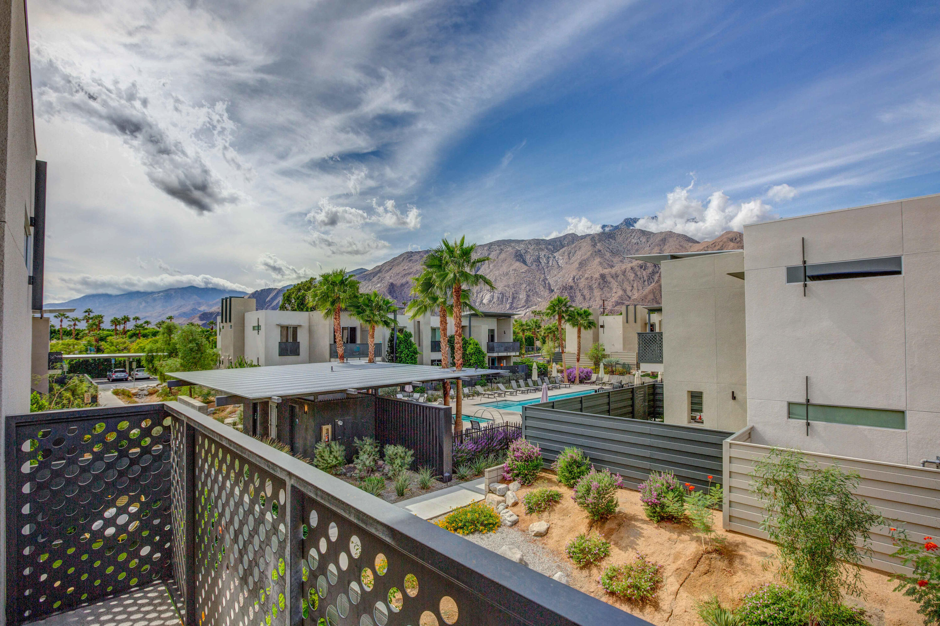 a view of swimming pool from a balcony