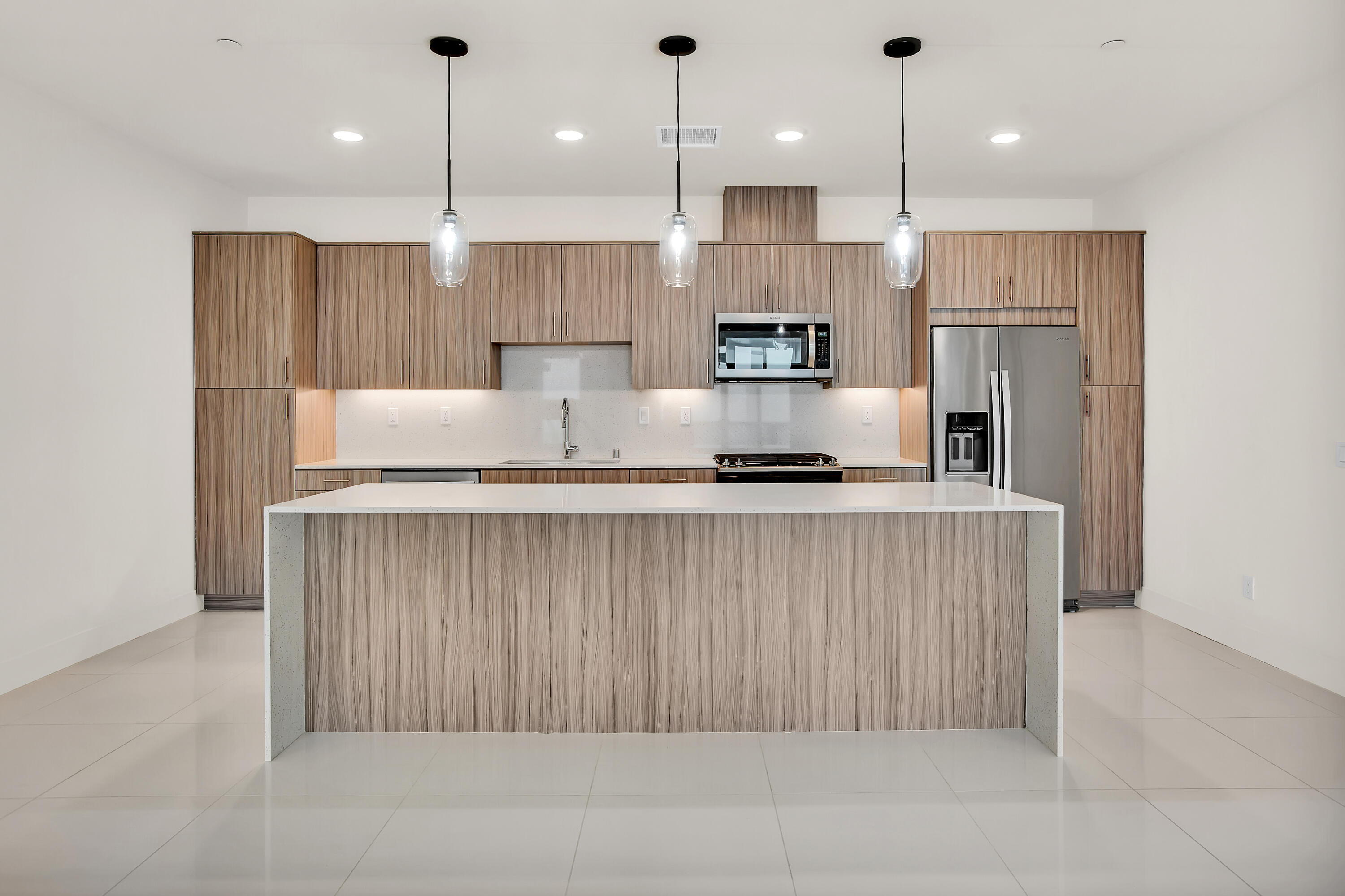 191 The Riv Palm Springs, CA 92262 - Photo 12 of 33 a kitchen with stainless steel appliances granite countertop a refrigerator a oven and a sink