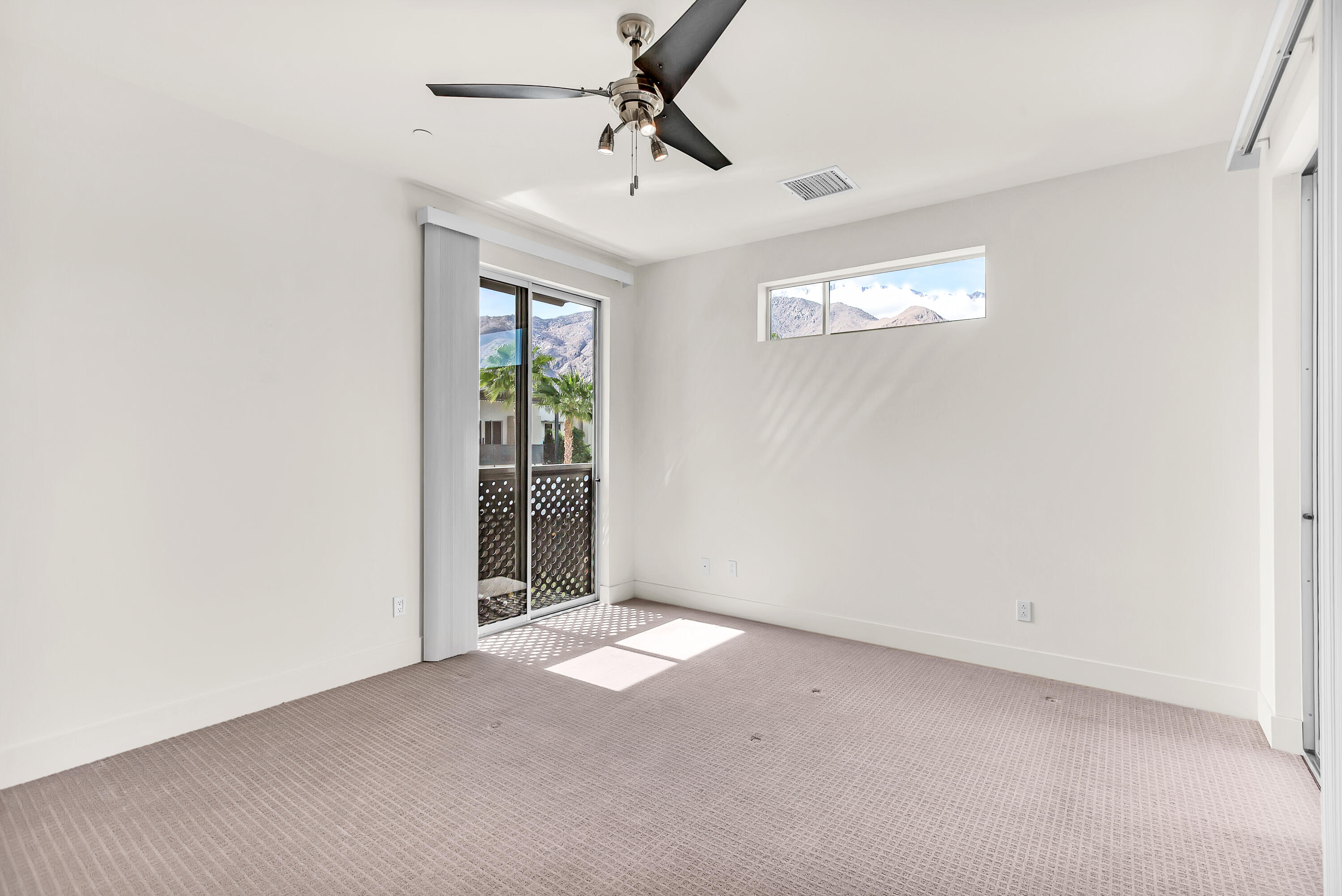 191 The Riv Palm Springs, CA 92262 - Photo 14 of 33 a view of an empty room with a window