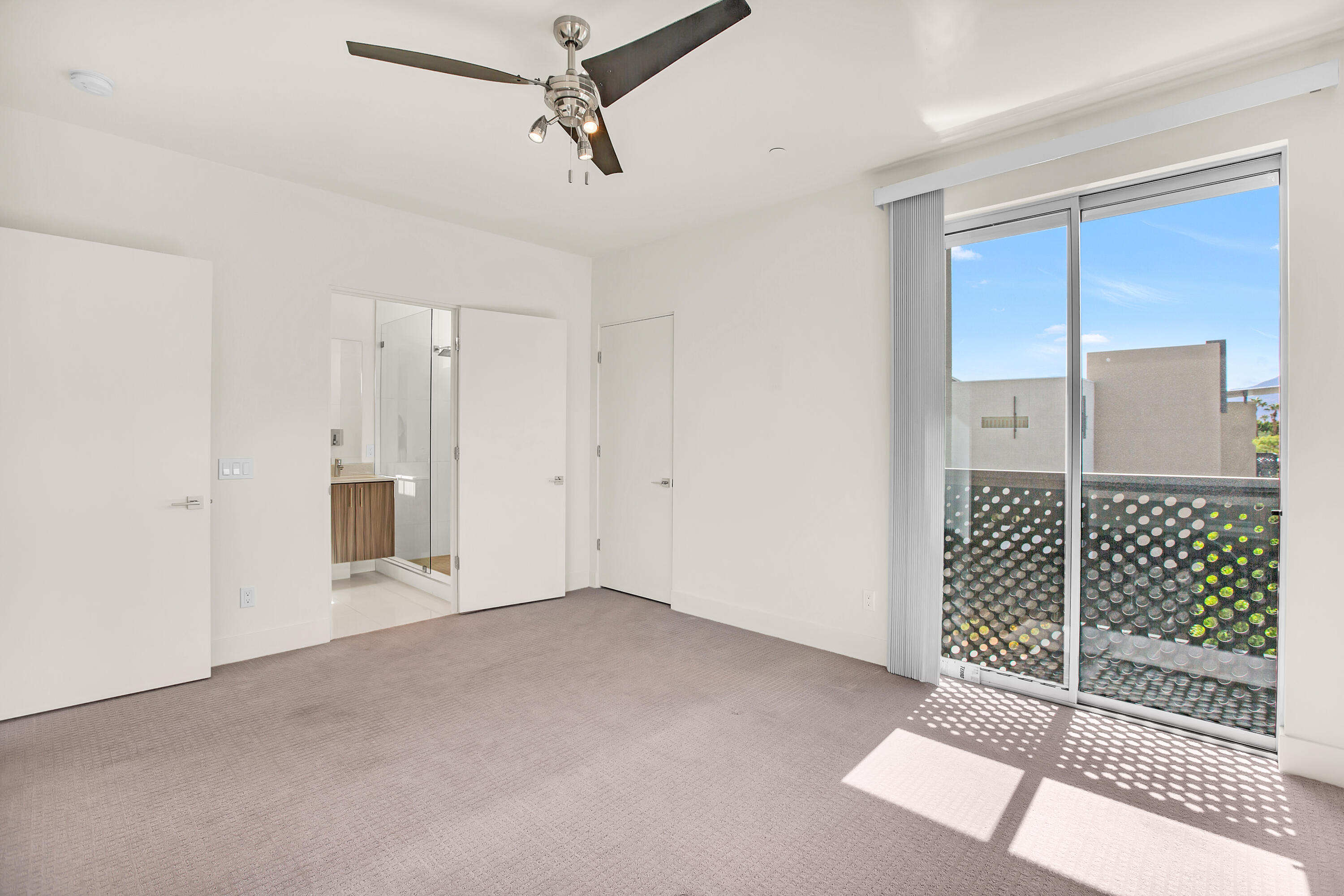191 The Riv Palm Springs, CA 92262 - Photo 15 of 33 a view of an empty room with a ceiling fan