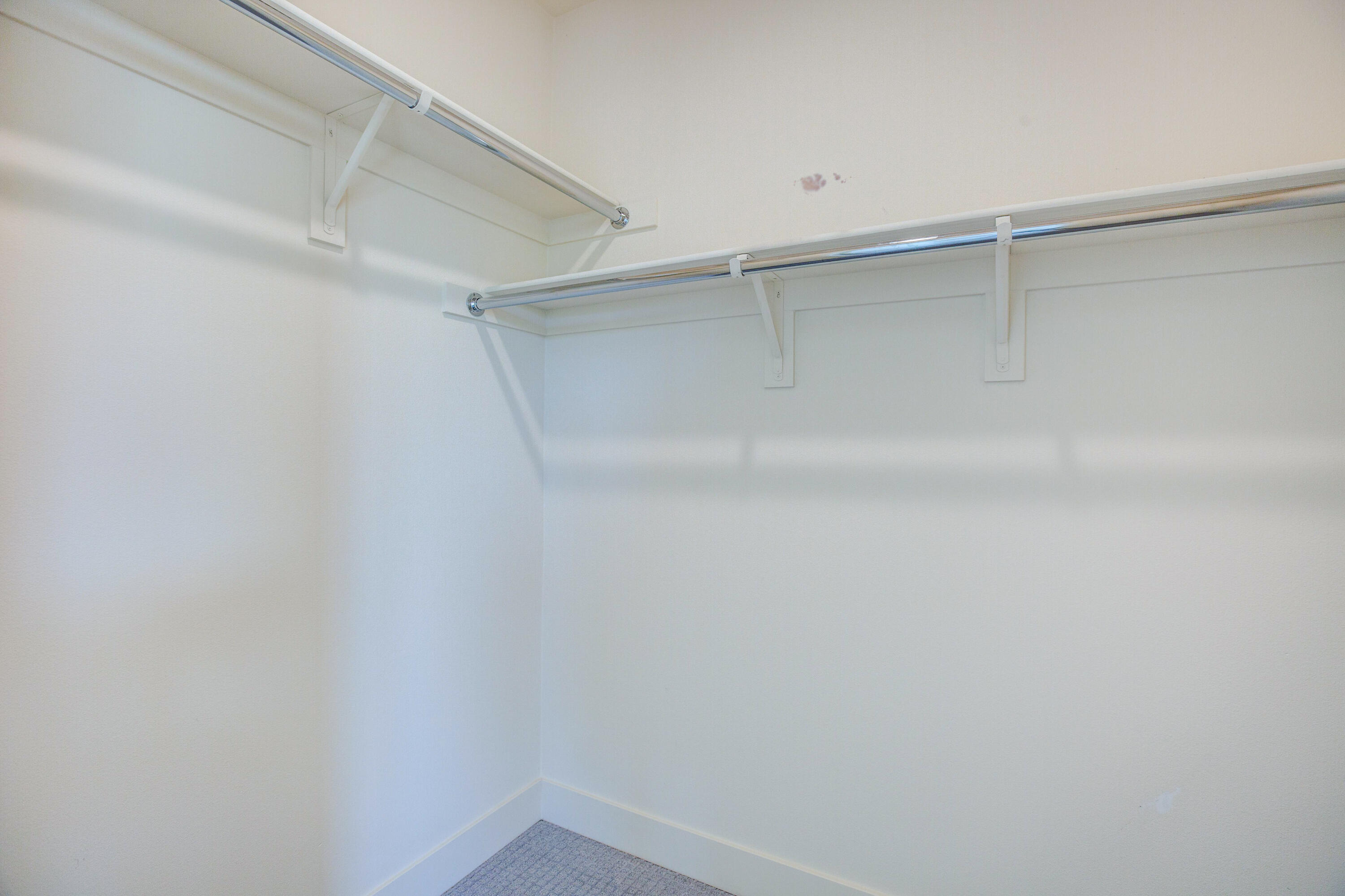 191 The Riv Palm Springs, CA 92262 - Photo 17 of 33 a view of an empty walk in closet