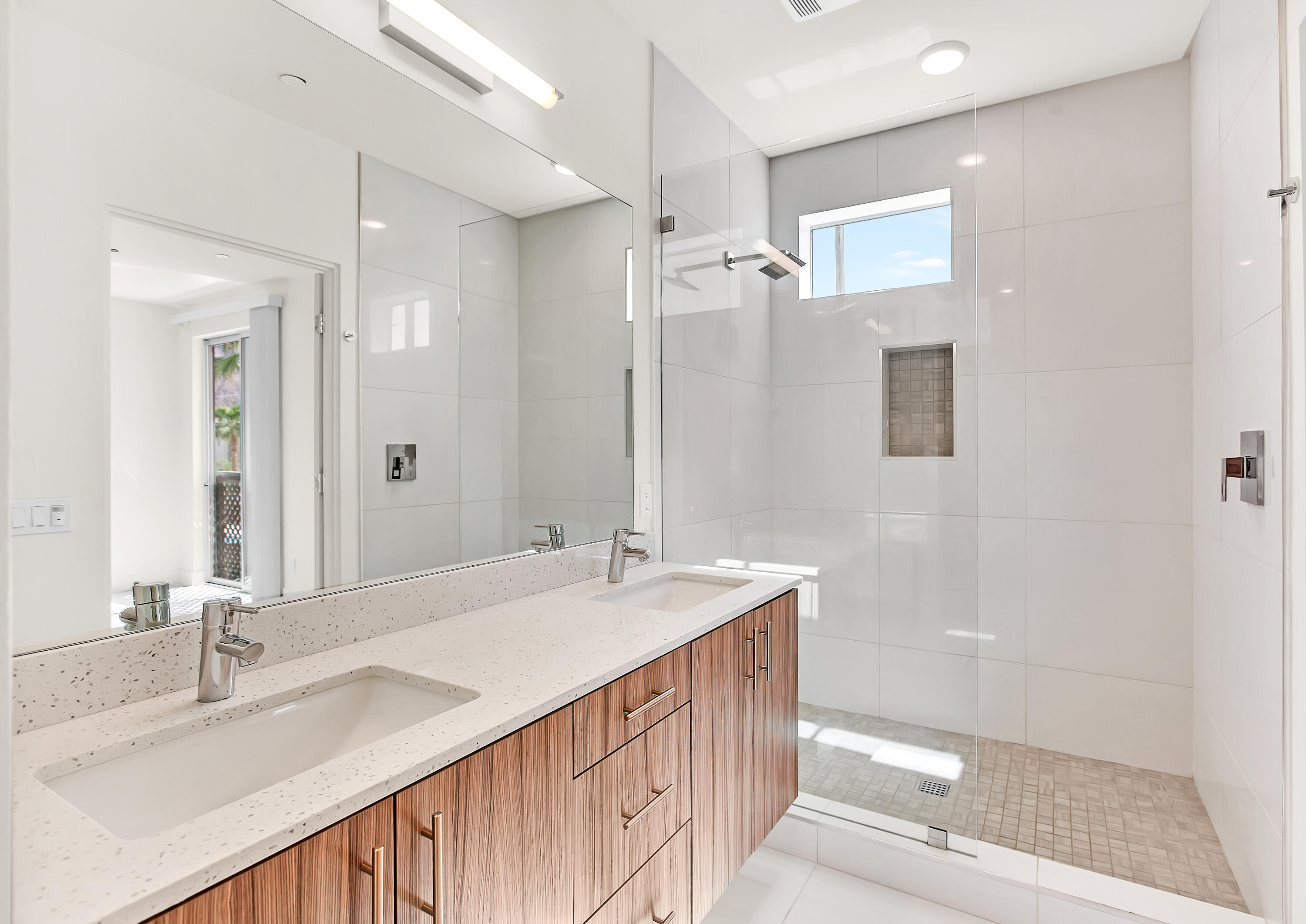 191 The Riv Palm Springs, CA 92262 - Photo 18 of 33 a bathroom with a sink double vanity and a mirror