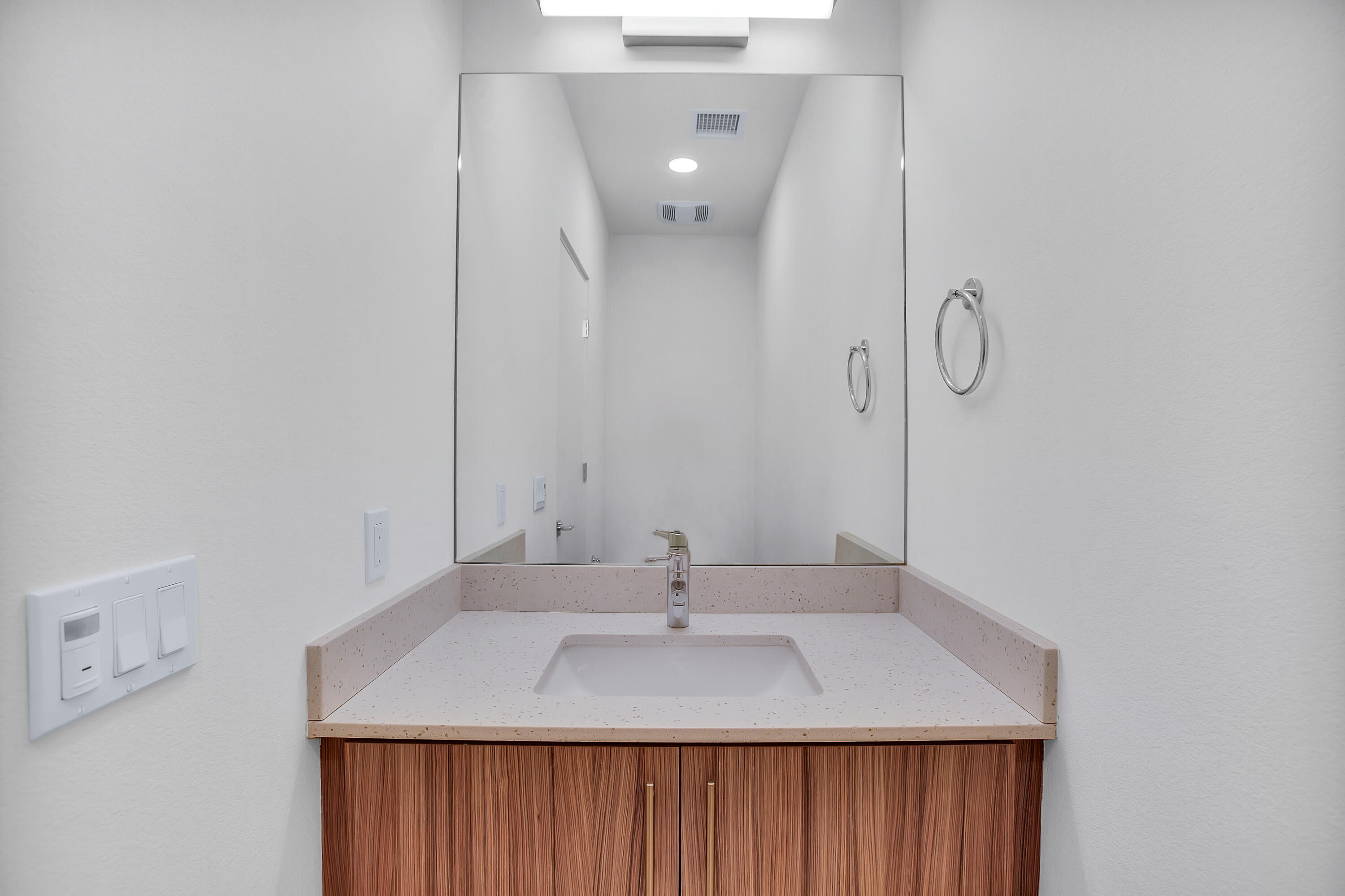 191 The Riv Palm Springs, CA 92262 - Photo 23 of 33 a bathroom with a sink and mirror