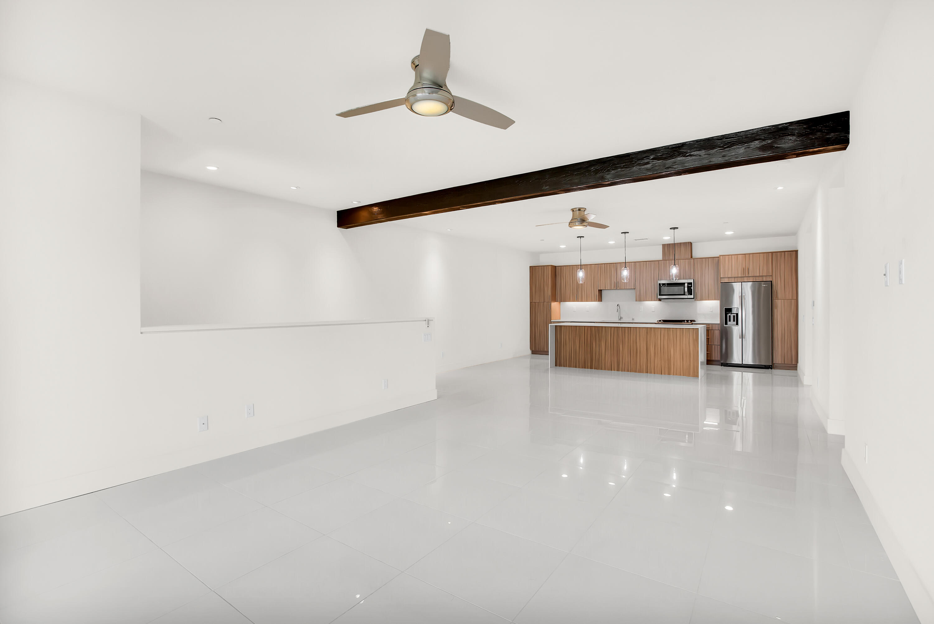 191 The Riv Palm Springs, CA 92262 - Photo 7 of 33 a view of a kitchen with a sink and a refrigerator