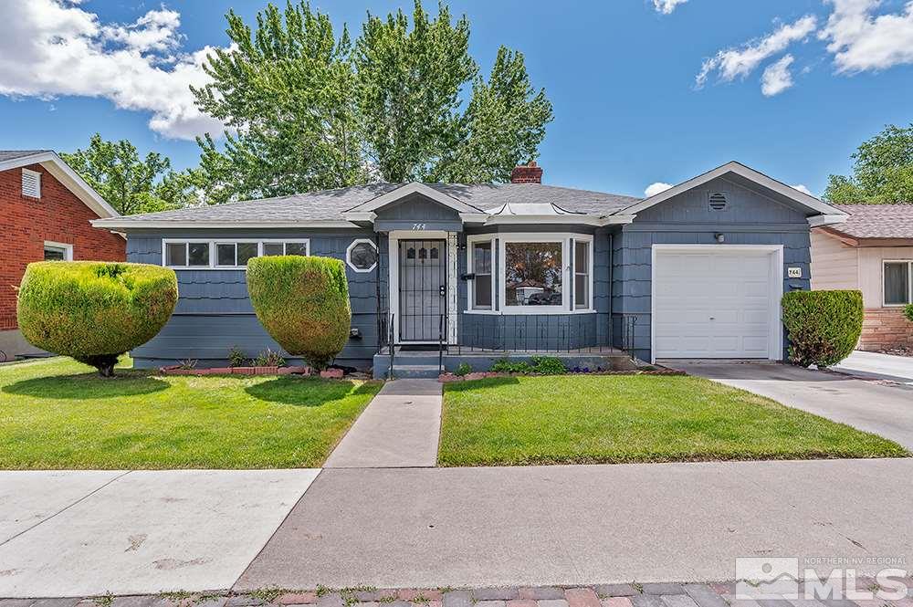 744 Roberts Street Reno, NV 89502 - Photo 1 of 23 a front view of house with yard and green space