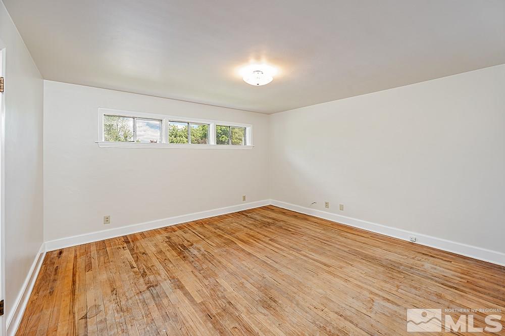 744 Roberts Street Reno, NV 89502 - Photo 11 of 23 a view of empty room with wooden floor