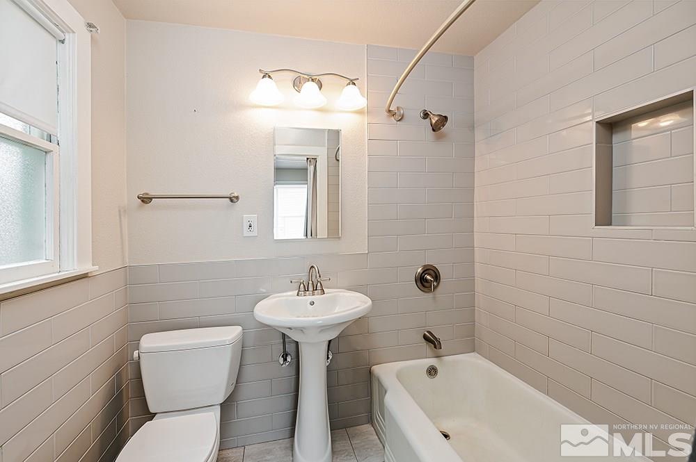 744 Roberts Street Reno, NV 89502 - Photo 17 of 23 a bathroom with a sink a toilet and shower