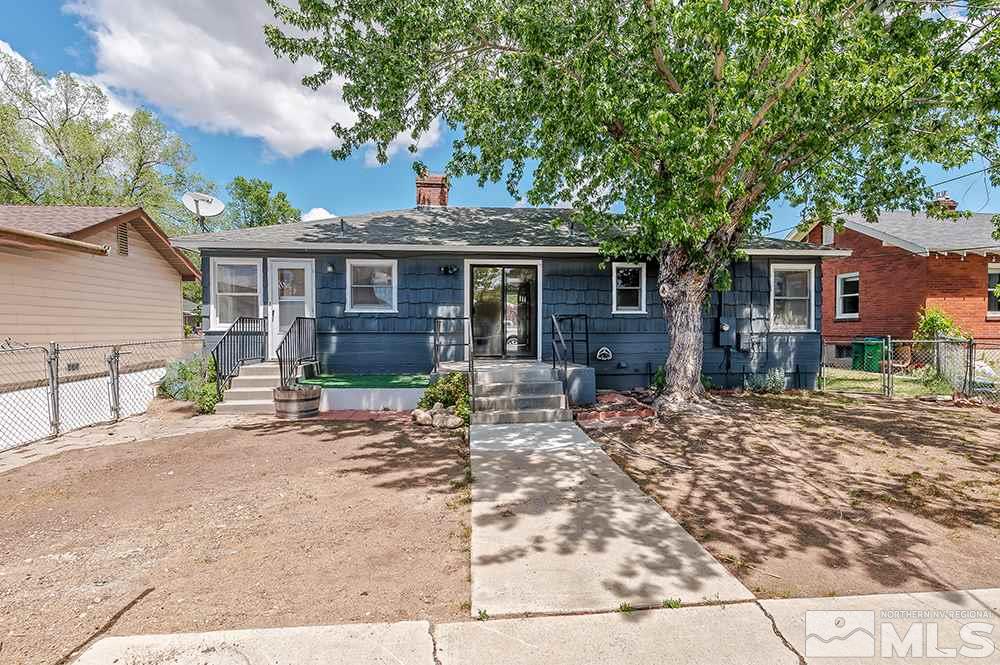 744 Roberts Street Reno, NV 89502 - Photo 19 of 23 a front view of a house with yard patio and glass windows