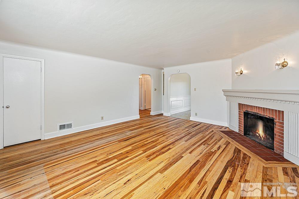 744 Roberts Street Reno, NV 89502 - Photo 3 of 23 a bedroom with a bed and a fireplace