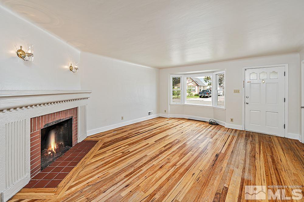 744 Roberts Street Reno, NV 89502 - Photo 4 of 23 wooden floor fireplace and natural light in room