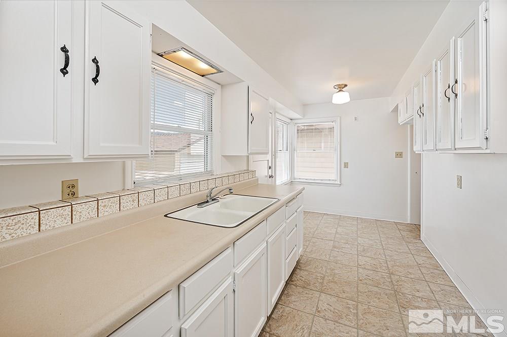 744 Roberts Street Reno, NV 89502 - Photo 5 of 23 a bathroom with a sink and a mirror