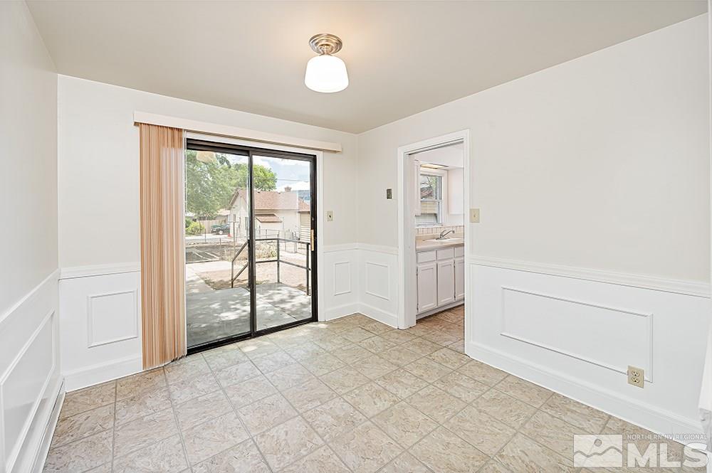 744 Roberts Street Reno, NV 89502 - Photo 7 of 23 a view of an empty room with a window
