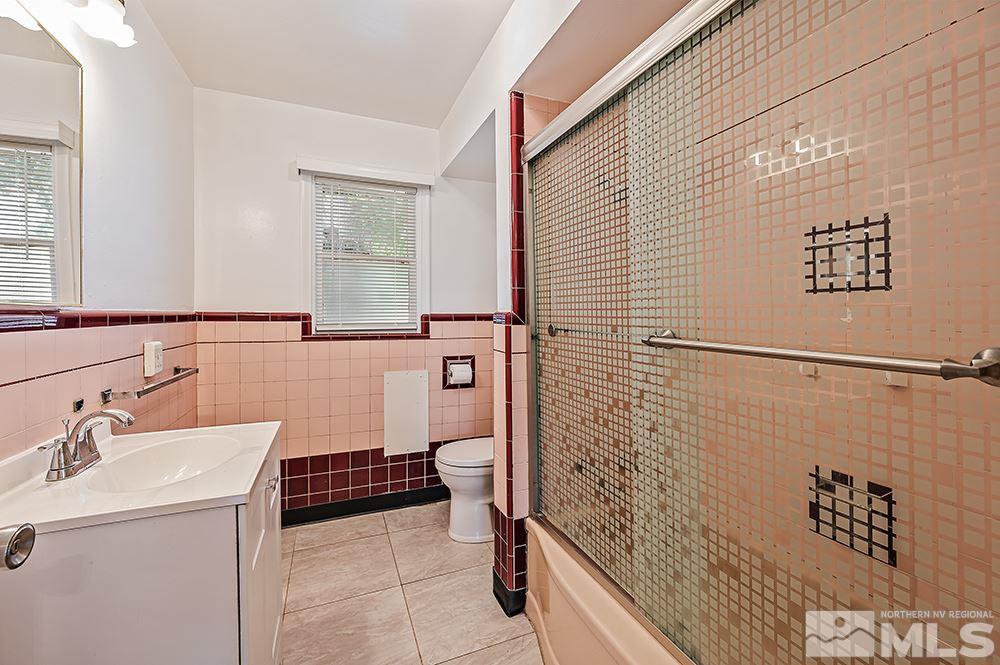744 Roberts Street Reno, NV 89502 - Photo 10 of 23 a bathroom with a sink and a mirror