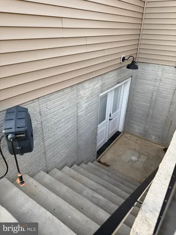 a view of a door and chair in the balcony