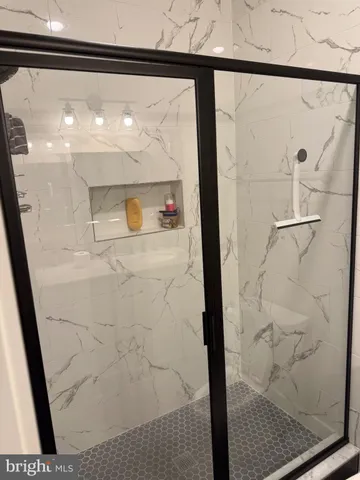 a bathroom with a sink and mirror